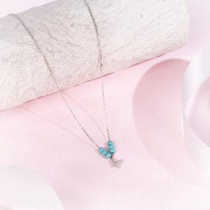 "Mystic Mermaid pendant on a delicate chain, inspired by ocean legends"