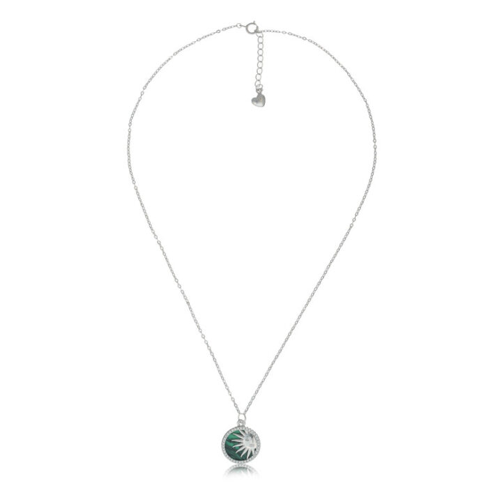 "Radiant emerald pendant surrounded by sunburst rays in a bold design"