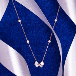"Elegant necklace featuring a butterfly charm with timeless design details"