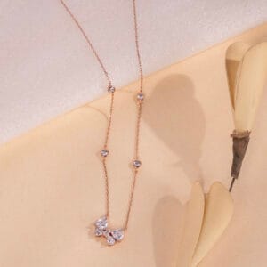 "Elegant necklace featuring a butterfly charm with timeless design details"