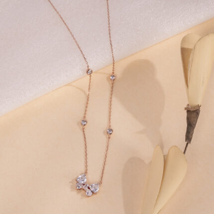 "Elegant necklace featuring a butterfly charm with timeless design details"