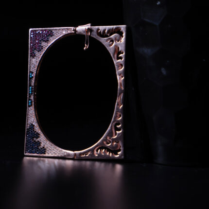 "Elegant bracelet with intricate carvings and vibrant multicolored beads"