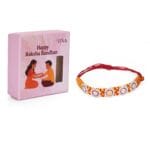 Om Shining Rakhi – Handwoven Thread with Silver & Stone Floral Charms - Image 3