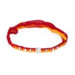 Lion Embossed Silver Rakhi – Red & Yellow Thread with Stone Accents