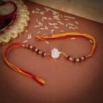 Divine Ganesha Rudraksha Rakhi – Silver Charm with Sacred Beads - Image 2