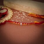 Om Motif Traditional Rakhi with CZ Stones - Image 2